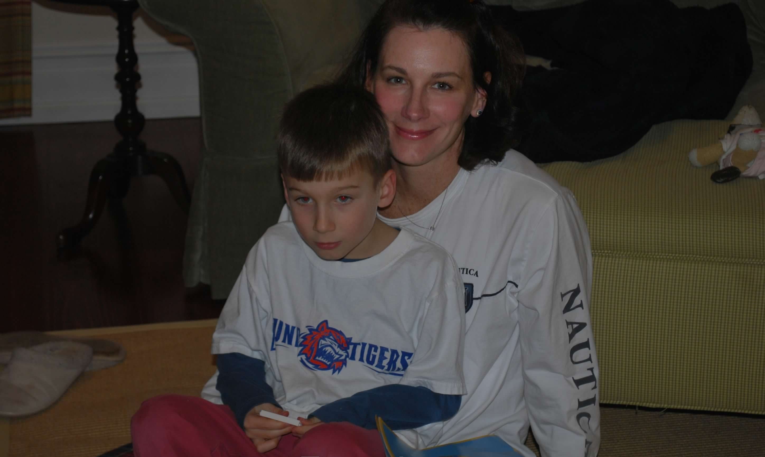 A mother and her young son reading together
